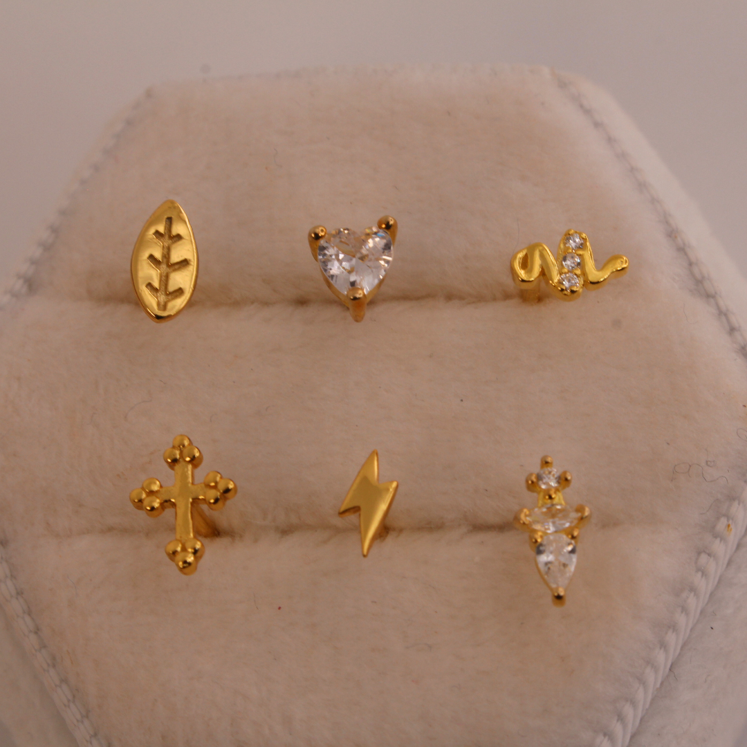 Piercings de rosca dorados