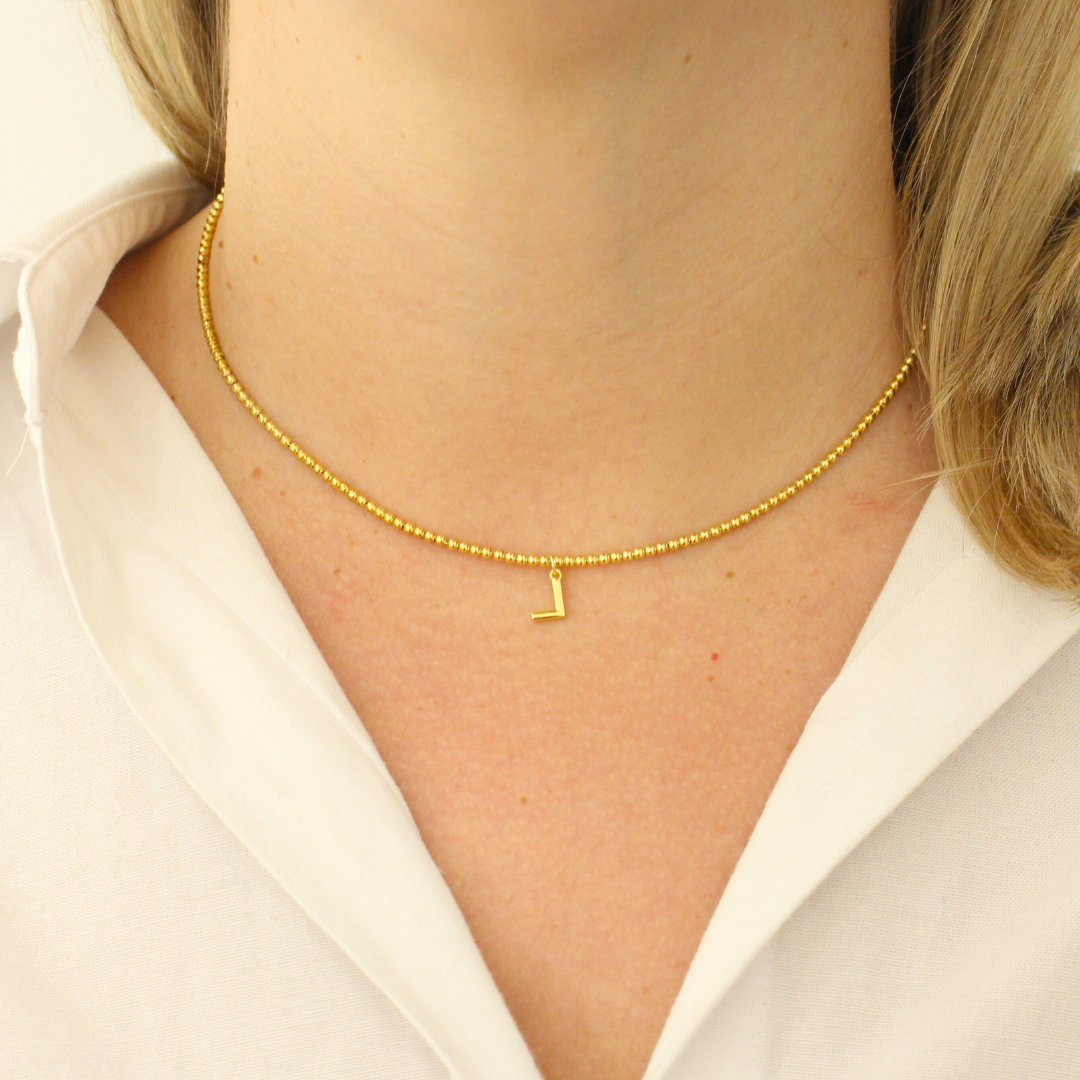 Collar bolitas unidas inicial oro