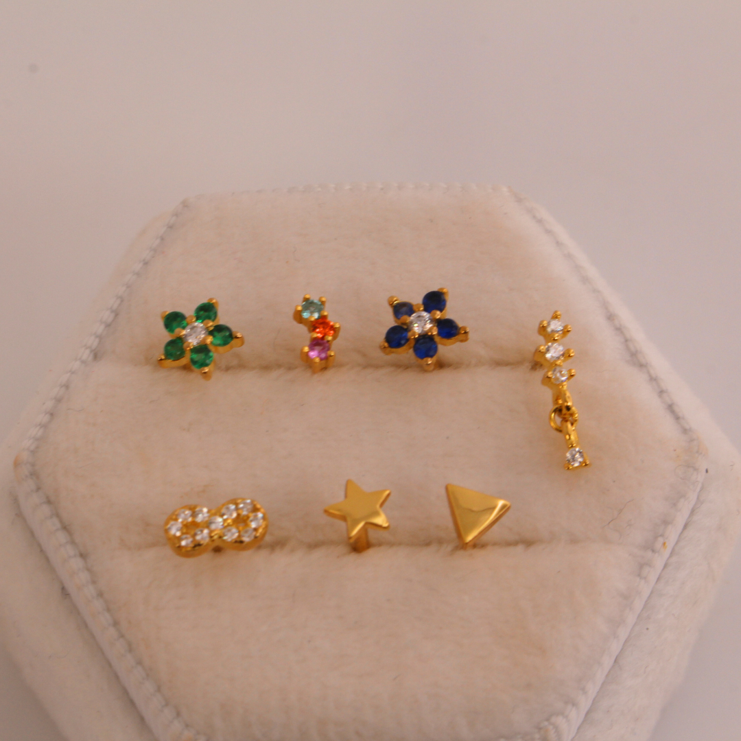 Piercings de rosca dorados