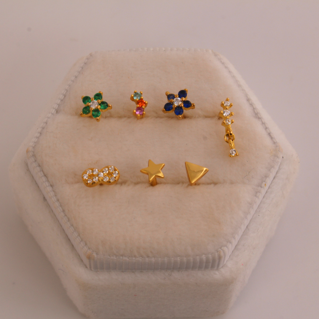 Piercings de rosca dorados