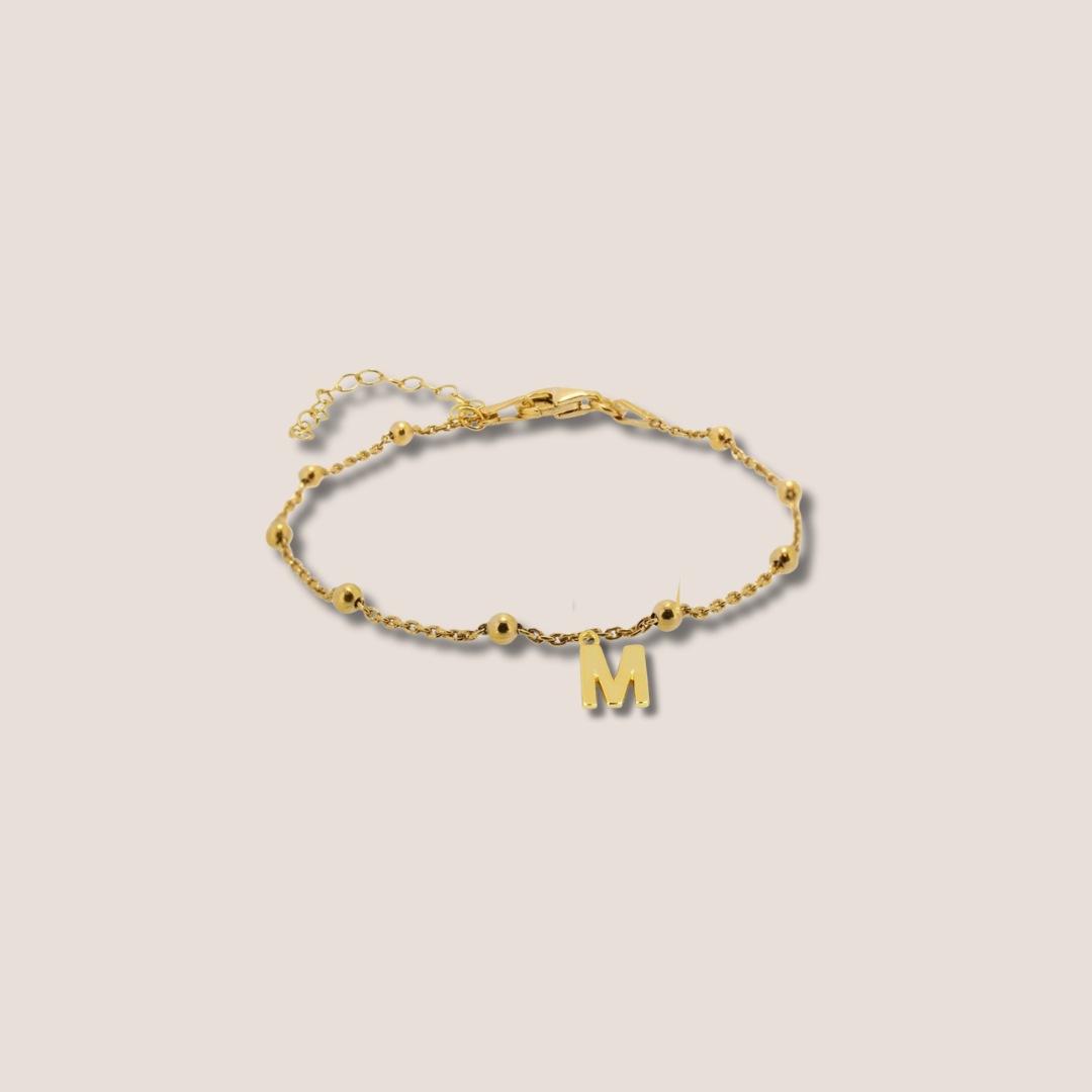 Pulsera dorada bolitas inicial