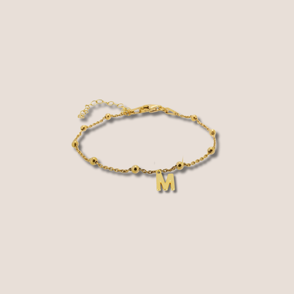 Pulsera dorada bolitas inicial